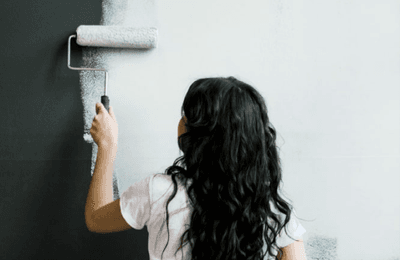 woman painting a wall